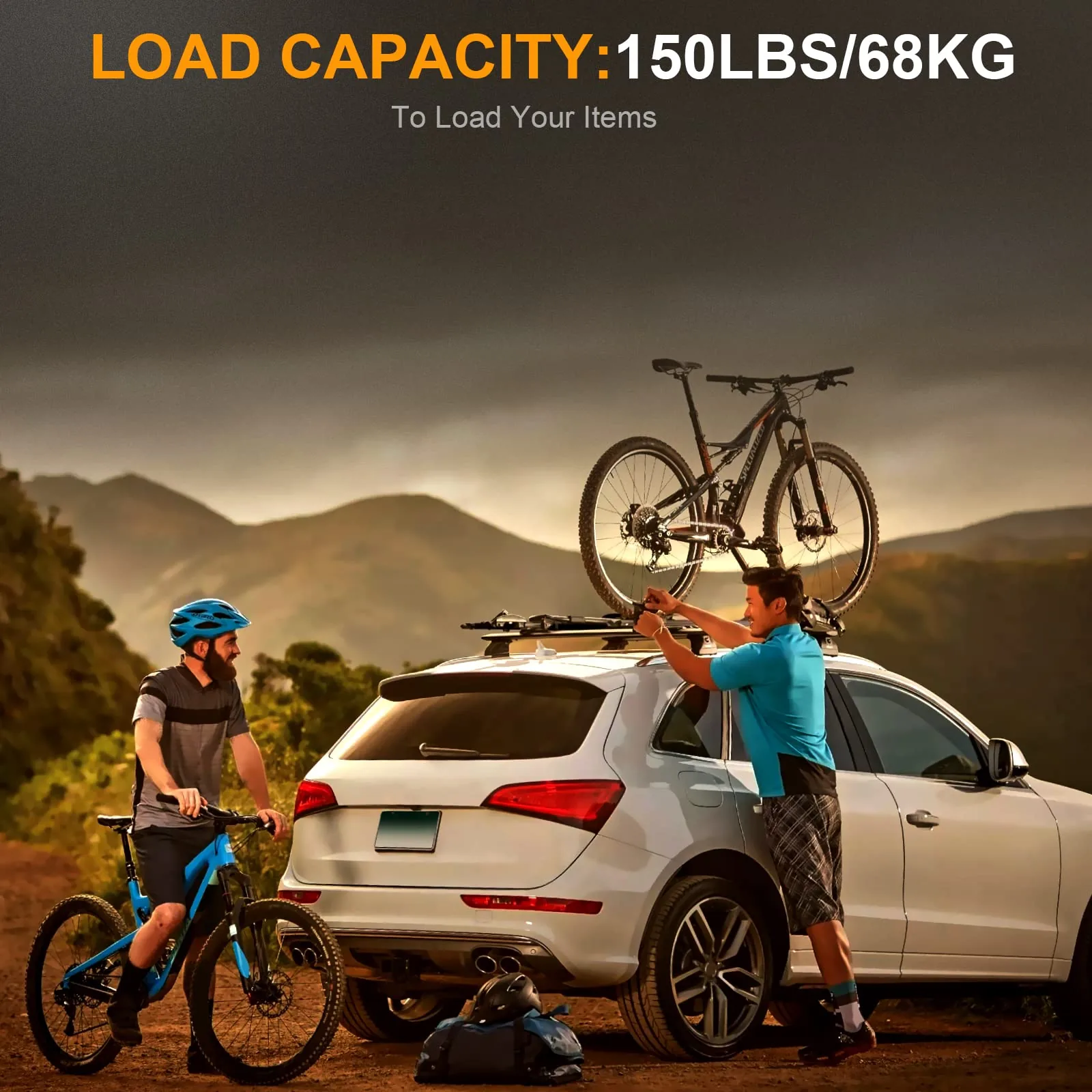 Two riders loading mountain bikes onto roof crossbars on an SUV at sunset